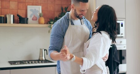 Dancing, home and couple with love, celebration and anniversary with happiness, marriage and care. People, man and woman in a kitchen, energy and bonding together with joy, relationship or commitment