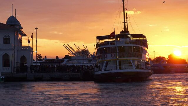sunset sky golden hour istanbul city ferry crowded passenger on board departure pier bay view slow motion panorama 4k turkey
