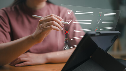 businesswoman Take an assessment, questionnaire, evaluation, online survey online exam Choosing the right answer in the exam, filling out an online survey form. Answer the test questions. © somyuzu