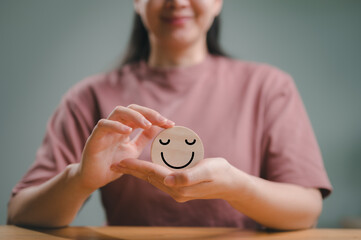 wooden label with happy smile relax face , good feedback rating, think positive, customer review, assessment, satisfaction, world mental health day, Calm mood, good mental health, good mood.