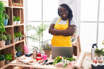 African american woman florist smiling confident standing with arms crossed gesture at florist