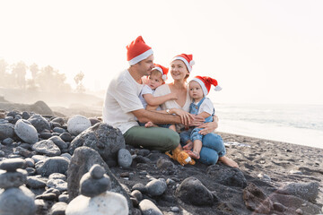 Family portrait on ocean beach. Christmas or New Year vacation.