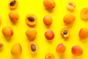 Sweet apricots on yellow background