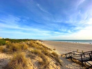 Fototapeta na wymiar Playa de la Barrosa beach and dunes at the Atlantic Ocean near Novo Sancti Petri, Costa de la Luz, Andalusia, Spain