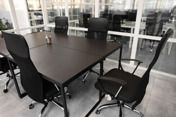 Comfortable office chairs and tables in meeting room