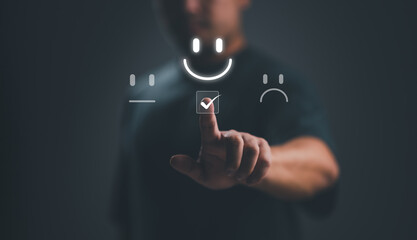 Businessman choosing on the happy Smile face icon to give satisfaction in service, Customer service...