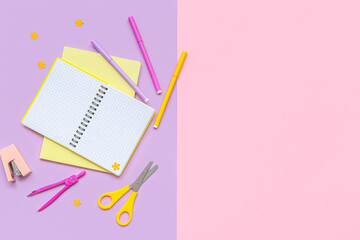 Composition with different school supplies on lilac background