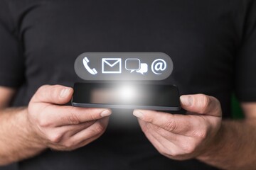Businessman using modern smartphone to contact and send information