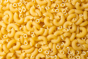 Uncooked Chifferi Rigati Pasta: A Culinary Canvas of Chifferi Rigati, Creating a Lively and Textured Background for Gourmet Cooking. Dry Pasta. Raw Macaroni - Top View, Flat Lay