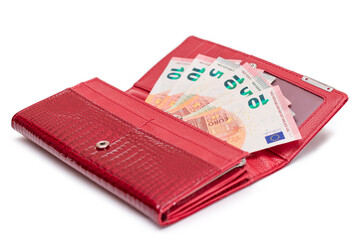 Opened Red Women Purse with 10 Euro Banknotes Inside - Isolated on White Background. A Wallet Full...