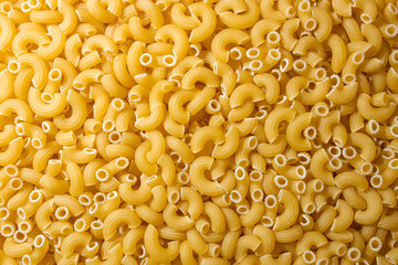 Uncooked Chifferi Rigati Pasta: A Culinary Canvas of Chifferi Rigati, Creating a Lively and Textured Background for Gourmet Cooking. Dry Pasta. Raw Macaroni - Top View, Flat Lay