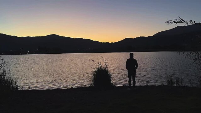 silhouette of a person on a lake,sunset, beach, sea, sky, silhouette, water, sun, ocean, sunrise, couple, lake, people, fishing, sand, nature, landscape, coast, vacation, summer, dusk, dawn, woman, fi