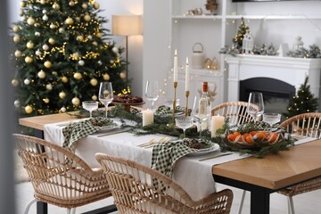 Christmas table setting with festive decor and dishware in living room