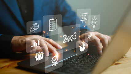 New business startup and Goals target on 2023, Plans and Visions for Year 2023. Businessman working with graph corporate and data growth 2023. Planning, opportunity, challenge and business strategy.