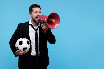Emotional sports fan with ball and megaphone celebrating on light blue background. Space for text