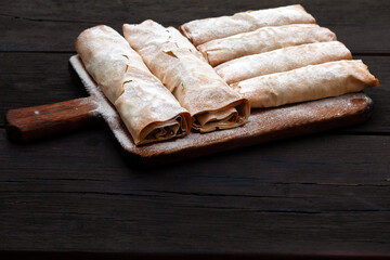 Apple Pie - Strudel on a Wooden Plate Copy Space - Traditional European Desert