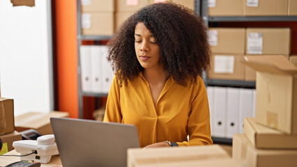 African american woman ecommerce business worker using laptop at office