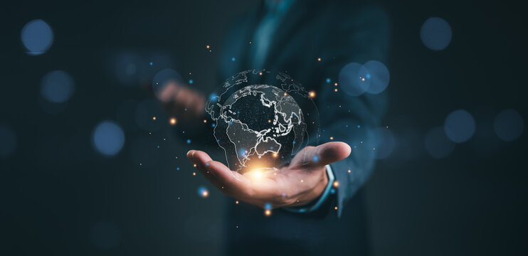 businessman holding Global network connection. Big data analytics and business intelligence concept. World map point and line composition concept of global business.Digital link tech.
