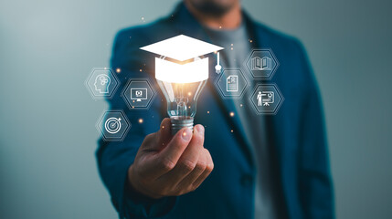 E-learning graduate certificate program concept. Man hands showing graduation hat in light bulb,...