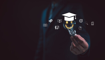 E-learning graduate certificate program concept. Man hands showing graduation hat in light bulb,...