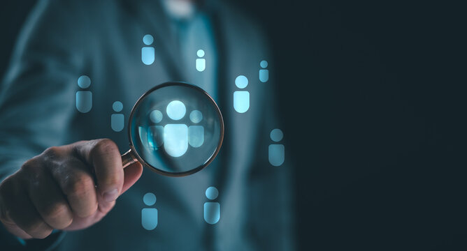 HRM or Human Resource Management, CEO use magnifier glass focus to manager icon which is among staff icons for human development recruitment leadership and customer target group concept.