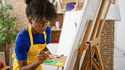 African american woman artist drawing at art studio