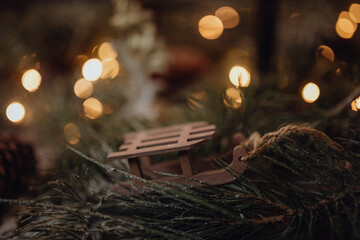 Christmas dark academia vintage winter wooden table with fir branches, pine cones, black candles...