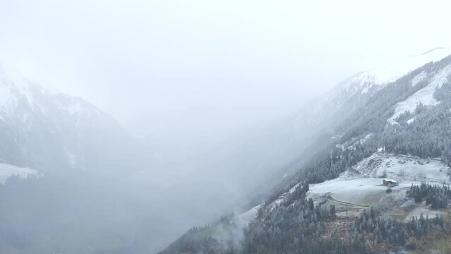 Fog and falling snow in the mountains. Time lapse. Weather in the mountains time lapse. 4k footage