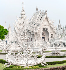 Wat Rong Khun,the White Temple at dawn,and surrounding pond,outskirts of Chiang Rai,Northern Thailand.