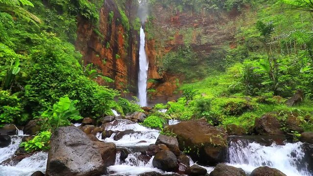 waterfall in the middle of the forest, java indonesia