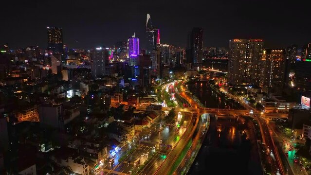 Take-off Drone shot, Aerial view of traffic in Ho Chi Minh City, Vietnam at night.