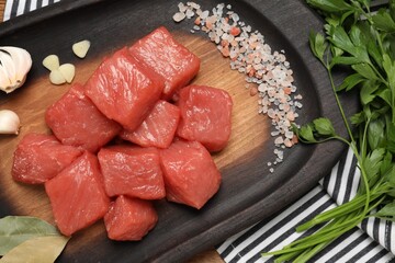 Raw beef meat and different ingredients for cooking delicious goulash on table, flat lay