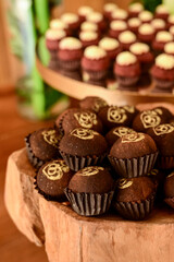 box of chocolate candies, chocolate candies on a plate, box of chocolates, birthday party, candy store, shop window
