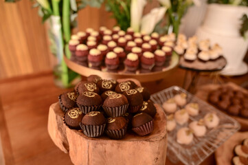 box of chocolate candies, chocolate candies on a plate, box of chocolates, birthday party, candy store, shop window
