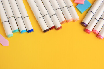 Different school stationery on yellow background, above view with space for text. Back to school