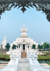 Amongst surreal structures,in the grounds of Wat Rong Khun,fantastical White Temple,Chiang Rai...