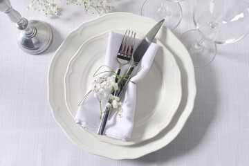 Beautiful table setting with floral decor, flat lay