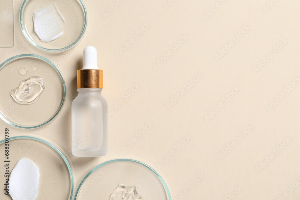 Poster bottle of cosmetic serum and petri dishes with samples on beige background, flat lay. space for text