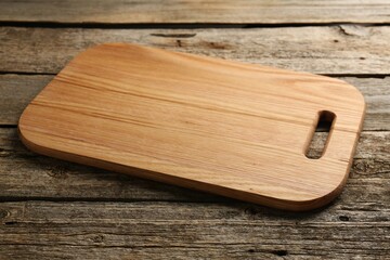 One new cutting board on old wooden table