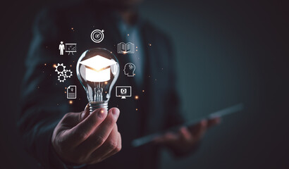 E-learning graduate certificate program concept. Man holding lightbulb showing education icon, Internet education course degree, study knowledge to creative thinking idea and problem-solving solution.