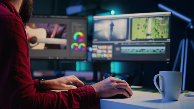 Video editor arranging recorded stock clips into seamless whole in creative multimedia agency. Videographer manipulating film pieces, assembling recorded footage into finished project