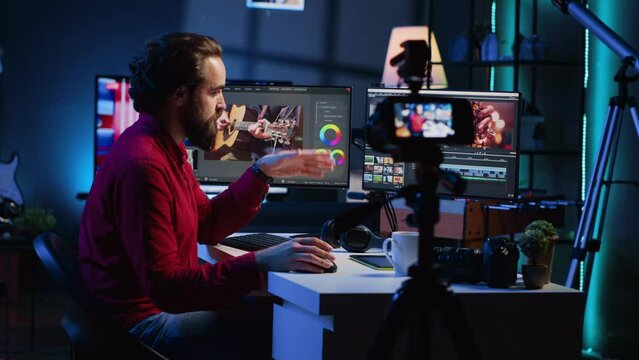 Videography content creator recording tutorial using professional camera, talking with audience about elevating video quality with skillful editing techniques. Media production influencer films guide