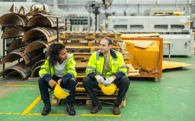 Cardboard workers chat, share ideas during breaks, foster togetherness, create positive workspace.
