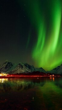A remarkable display of colors as an aurora dances in the skies above Lofoten.