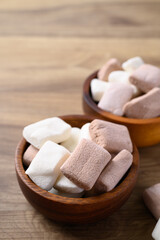 Marshmallow chocolate and vanilla in bowl on wooden background