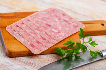 Image of slicing chopped ham from pork meat - obrazy, fototapety, plakaty