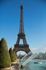 View of Eiffel Tower on blue sky background on sunny day