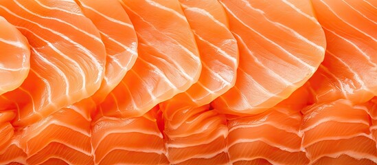 Texture of sliced raw salmon fillet seen up close.