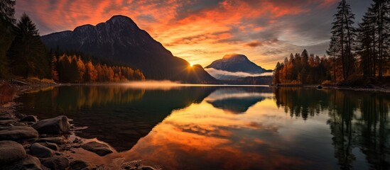 Stunning fall sunset at Hintersee lake in Ramsau, Upper Bavaria, Germany. - Powered by Adobe