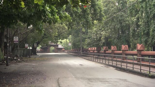 Empty road in front of Mananchira Square gate early in the morning in Calicut Kozhikode. A coastal city in Kerala, India.